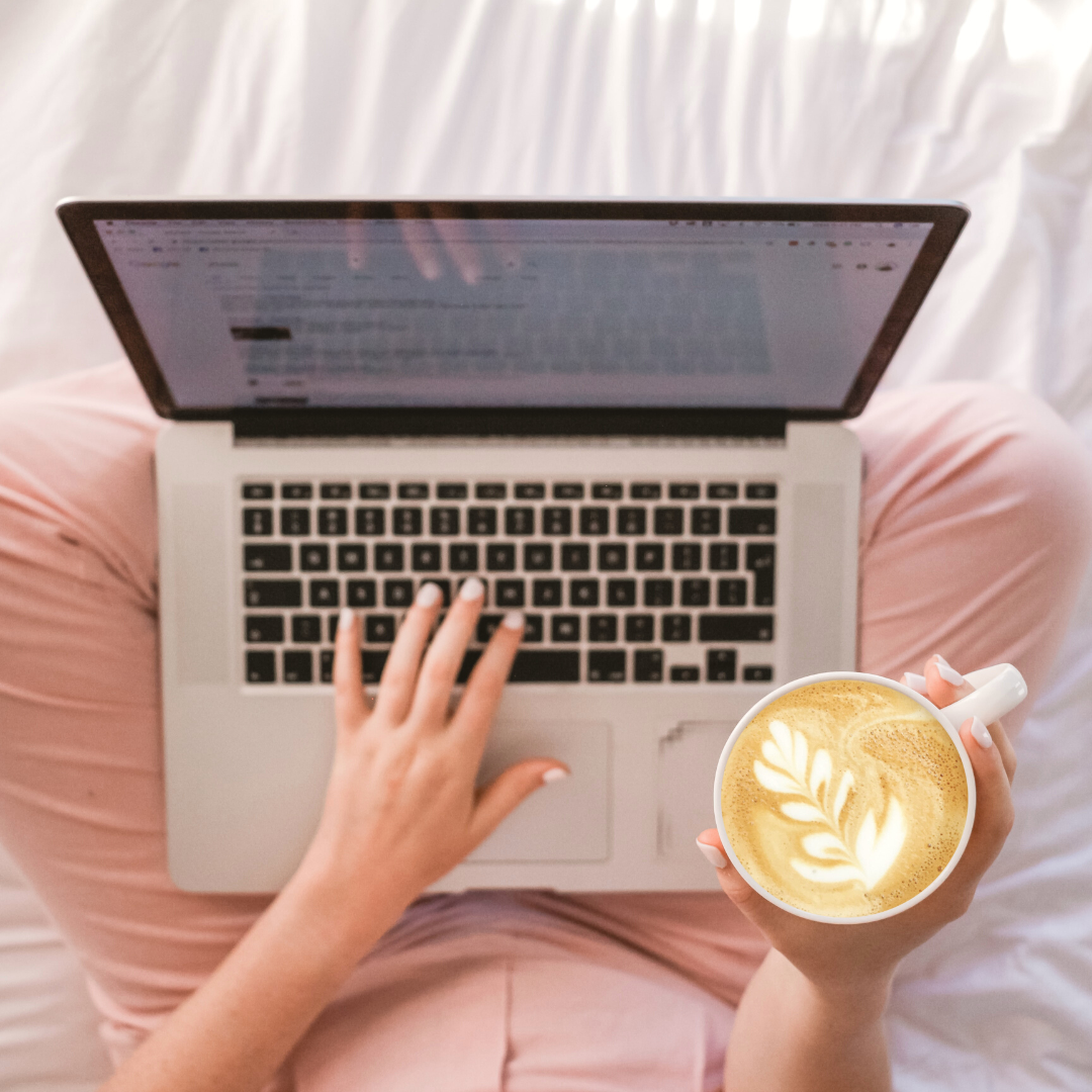 woman working on email marketing on laptop with coffee in her hand